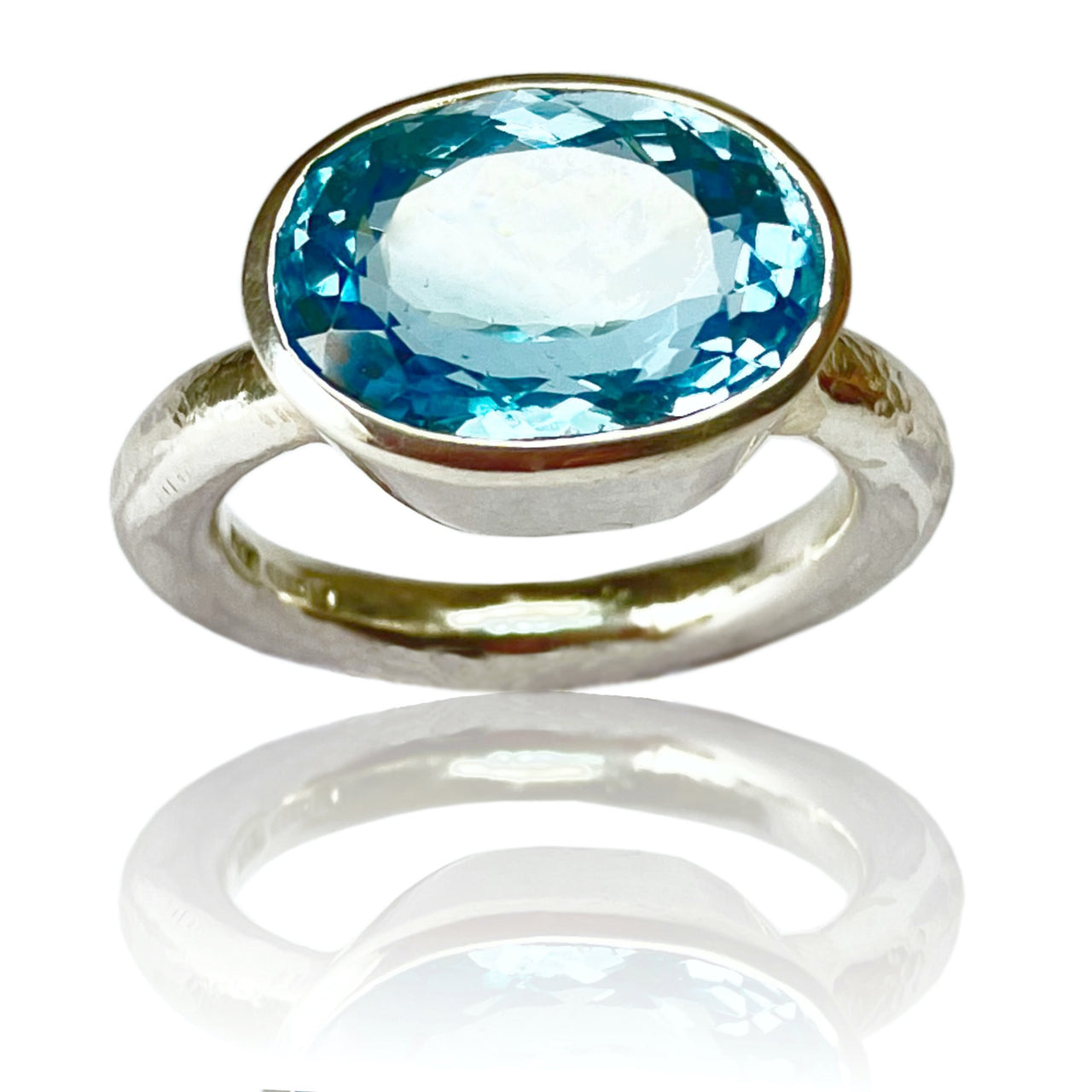 Silver and blue topaz ring