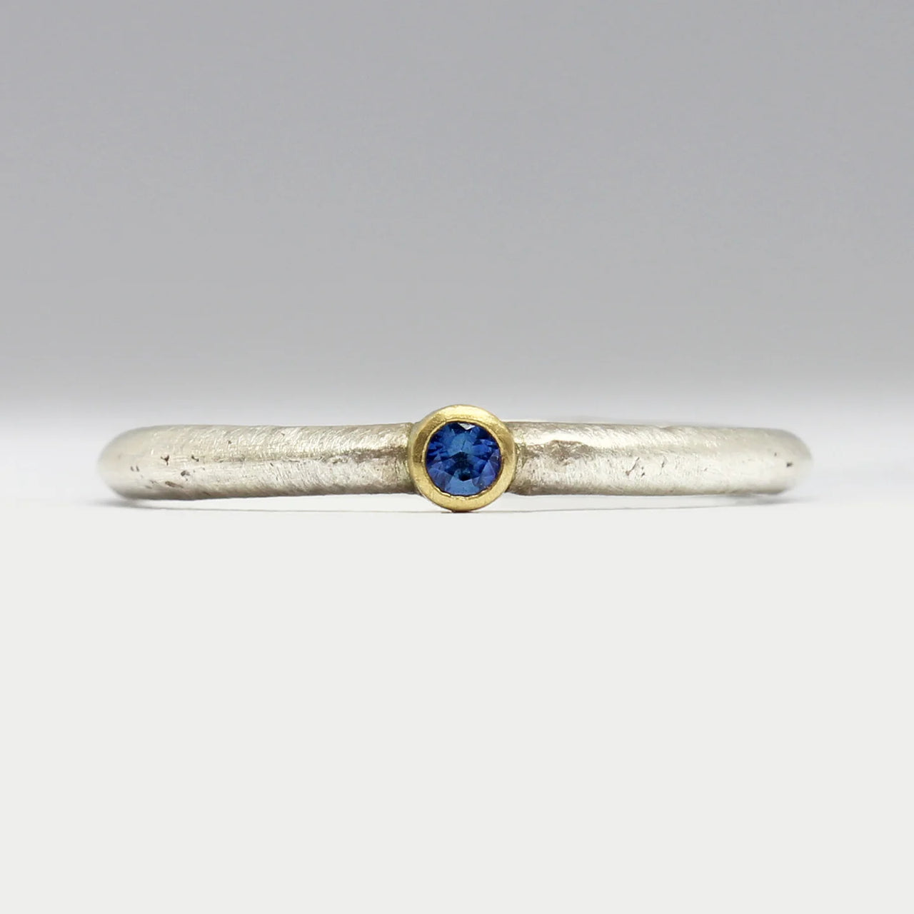 Silver and 18ct Yellow Gold Sandcast Ring with Sapphire