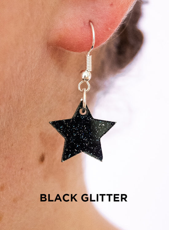 Black glitter star charm earrings